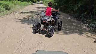 Just cruising a dirt road on 4wheelers