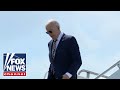 Biden caught walking alone while masked outside