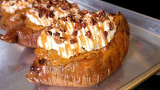 Twice baked Sweet Potatoes | Baked sweet potatoes with whipped cream pecans and caramel on top.