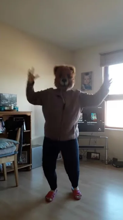 Grandma wolf doing star jumps
