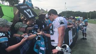 Luke Kuechly and Christian McCaffrey sign autographs