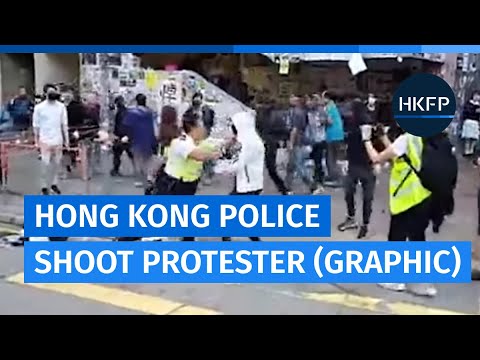 Hong Kong police shoot black-clad protester in stomach