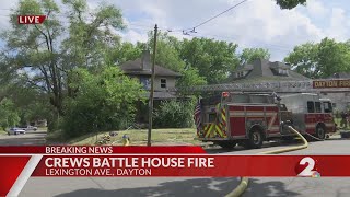 Crews battle house fire in Dayton
