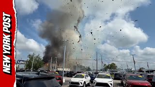 Black Smoke Rises After Massive Explosion Caused From Car Crashing Into Vet Clinic