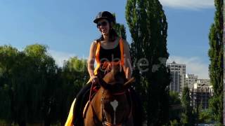 The Horse Nods Her Head In Slow Motion. Rider Woman Sitting On Horseback.
