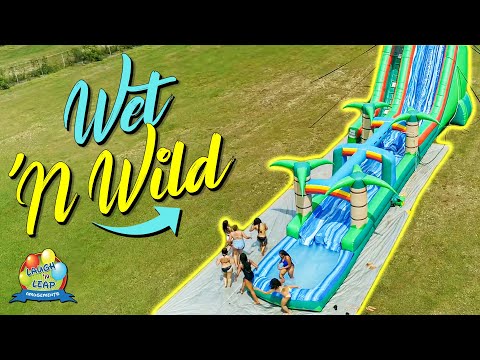 Wet n Wild Water Slide Fun - Girls having fun on a giant inflatable water slide @LaughnLeapAmusements