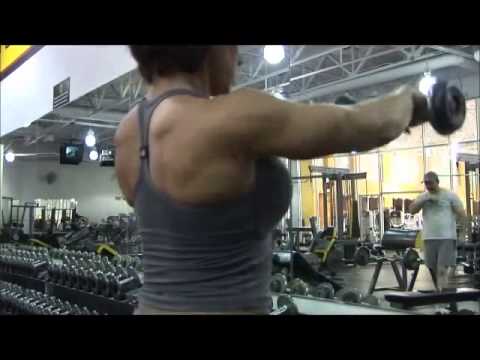 Muscle Building Beautiful Fitness girl with huge boobs flexing her
