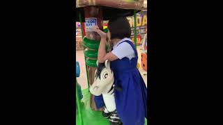 Matteo Zachary and Bettina on mini merry go round