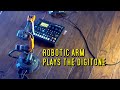 Robotic arm playing the digitone