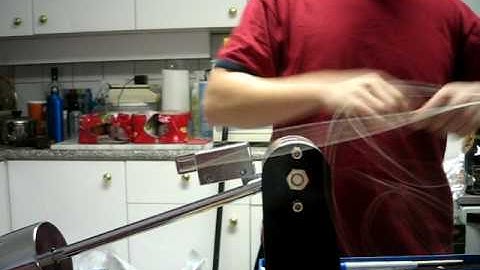 Applying tension on a drop-weight stringing machine w/ clutch