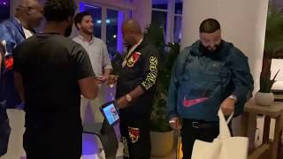 DJ Khaled meeting a bunch of robots
