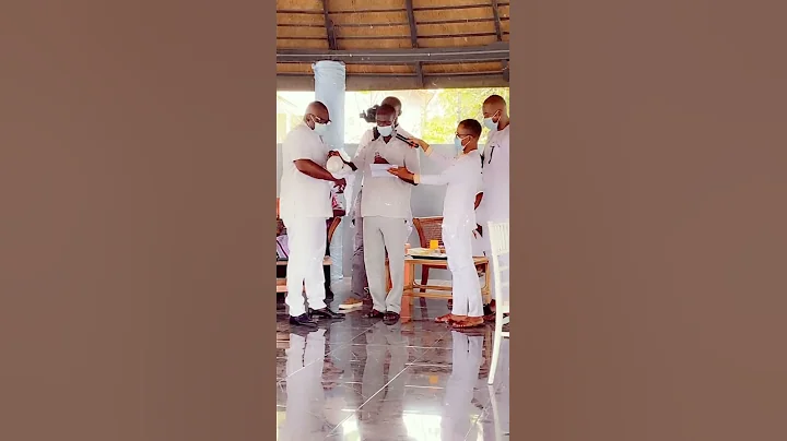 Baby Naming / Outdooring ceremony in Ghana. Baby is given different items and spoken to.