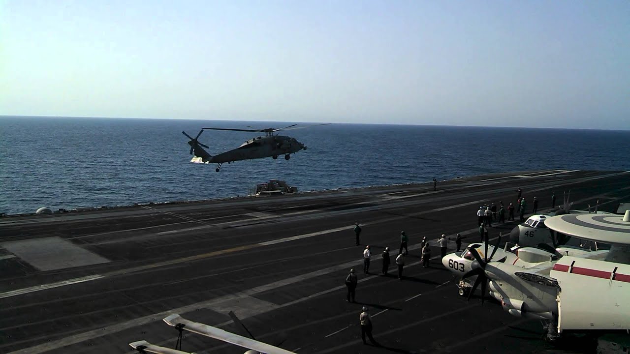 Helicopter landing on aircraft carrier - YouTube
