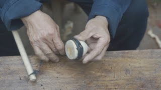 Grandpa Amu makes a spinning top, a great old toy