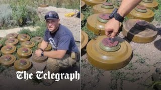 American volunteer in Ukraine shows danger of clearing landmines in farm fields