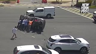 8 good Samaritans pull over, band together to flip over SUV and rescue driver after crash: video