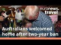 Australians in tears as travellers return home after two-year travel ban