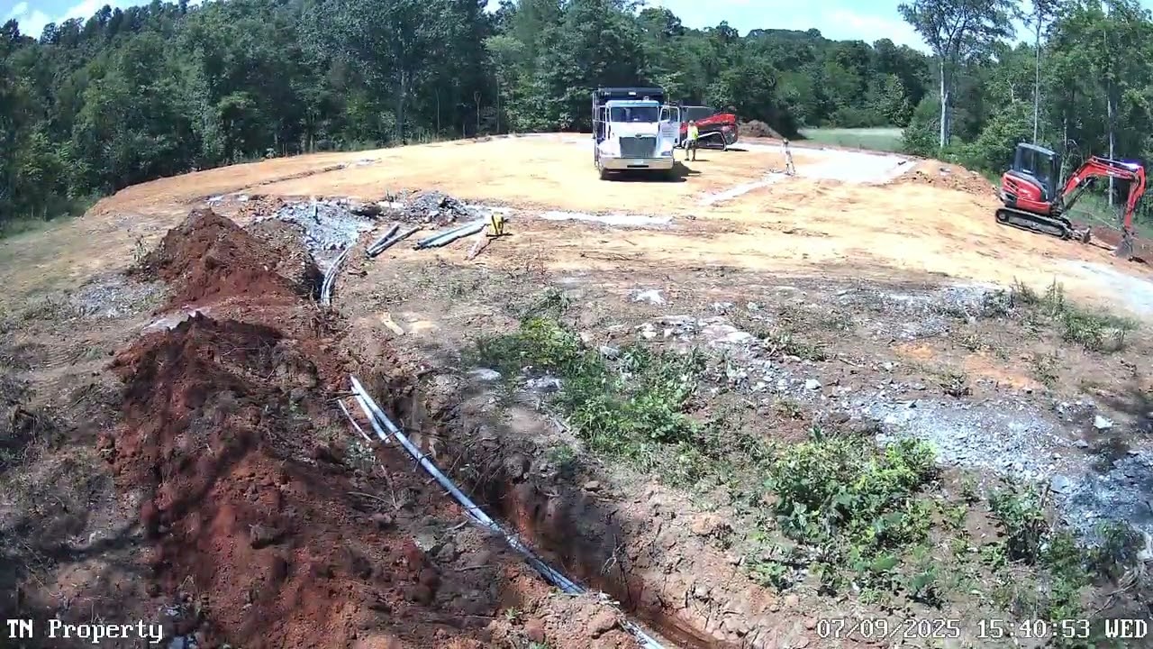 Set grade on house pad and add gravel.