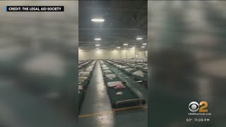 Defiant asylum seekers camping out outside Midtown hotel