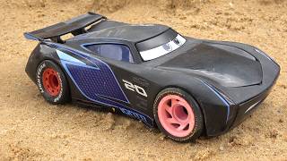 Toys cars in cardboard box and stories cars other