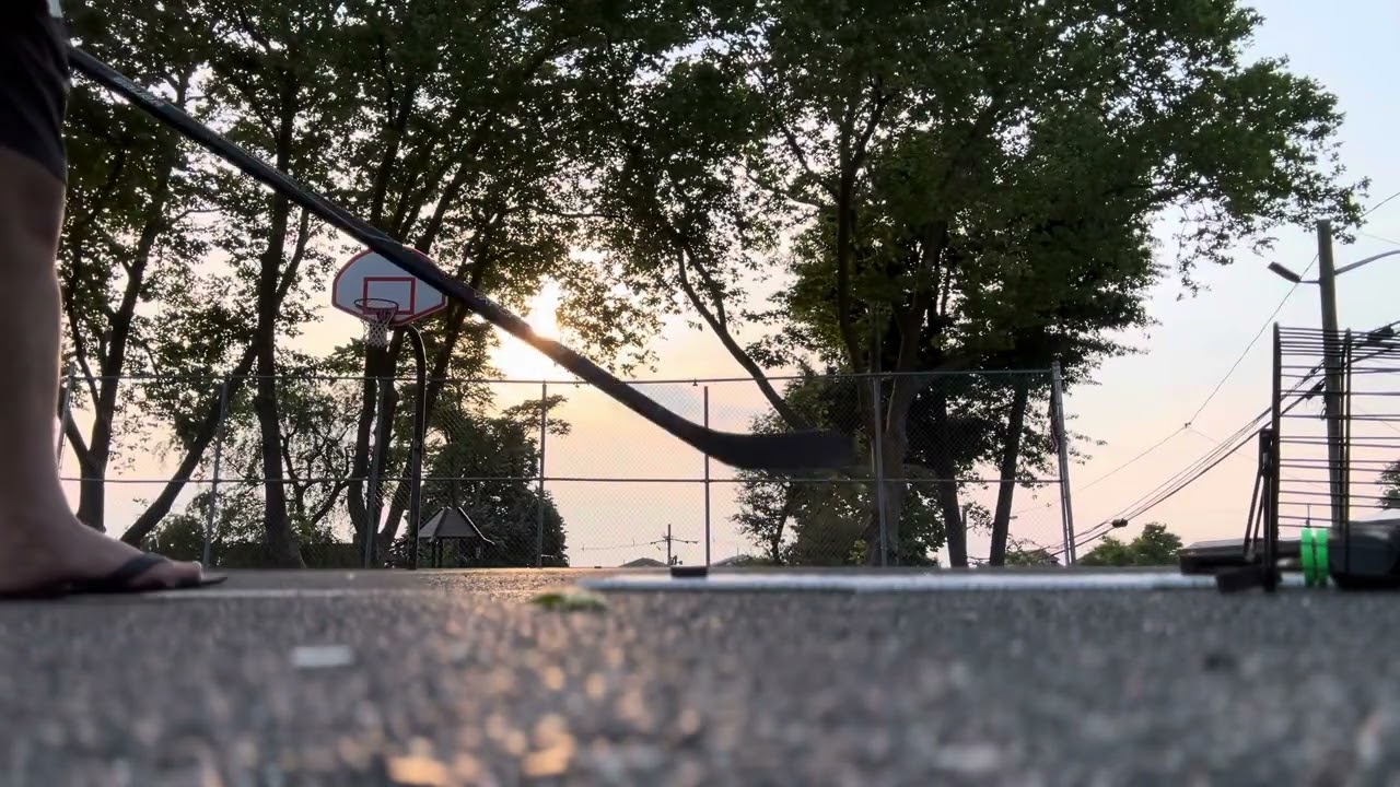 Slap shot back view. Range of shot. Half basketball court