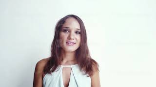 Young beautiful brunette woman talks against a white background has a video chat. 1920x1080, hd