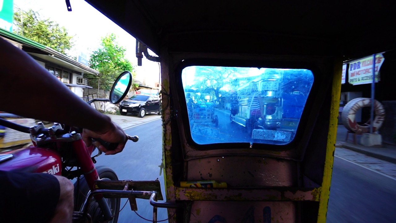 Philippines, tricycle ride from Our Lady of Eternal Peace a Memorial to San Isidro Elementary School
