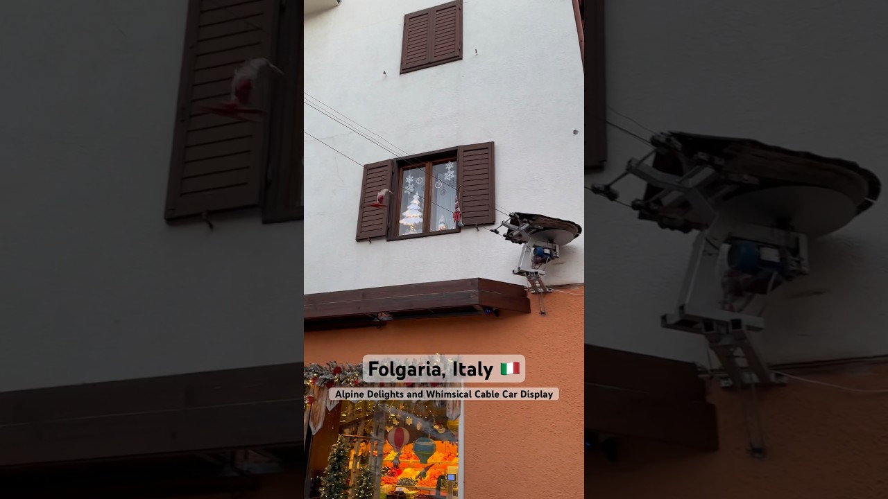 Square in Folgaria: Alpine Delights and Whimsical Cable Car Display