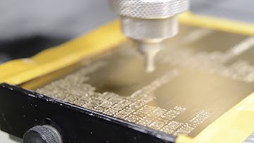 Diamond drag engraving on a brass plate