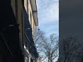 Removing icicles from roofs in downtown Perth