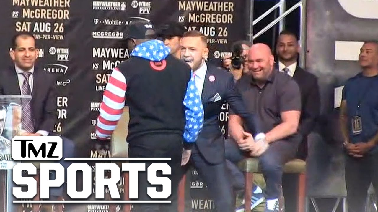 Conor McGregor Tells Floyd Mayweather 'F**k You' With His Pinstripe Suit