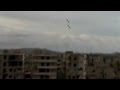 Captures bombs exploding in syrian city of daraya