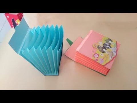 فيديو: كيف تصنع محفظة من جورب الطفل