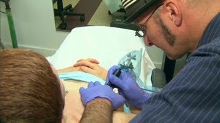Tattooist gives hope to cancer survivors