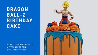 I baked a 4-layer 6” white almond cake frosted in sam’s club
vanilla icing that colored one sunset orange to match the dragon
ball-z theme. topped wi...