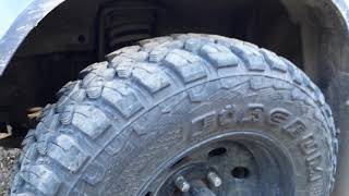 Micro-Pig volume 3. 2002 Kia Sportage Convertible,  lifted with mud tires!