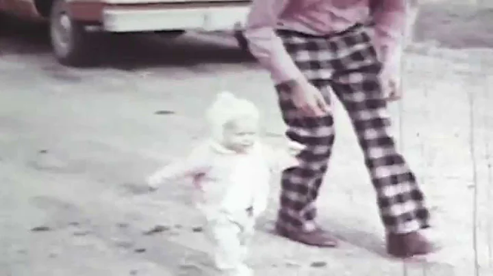 Sandra Kenny walking in backyard at 10 months old.