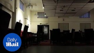 Eerie footage shows 'ghost' banging chairs and slamming door - Daily Mail