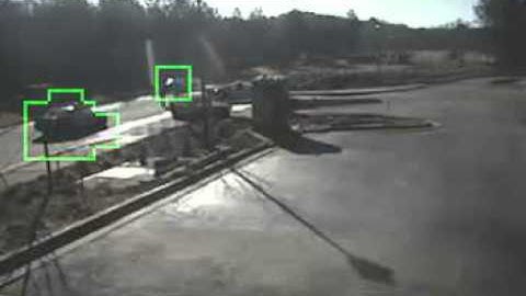 Surveillance camera showing police intervention at construction site for unusual activity
