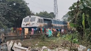 55749 NJP-HDB Passenger with SGUJ WDP4 (40025)  passes through Level Crossing Gate in Jalpaiguri.