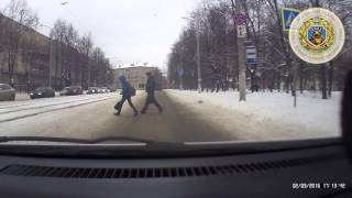 Belarusian Police Officer Pulls Child From Path of Car