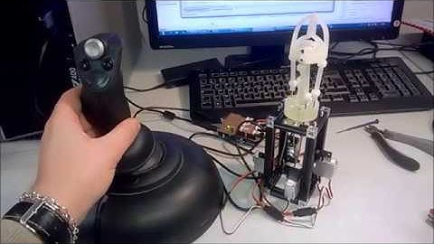 4-DoF spherical parallel wrist with embedded grasping capability for minimally invasive surgery