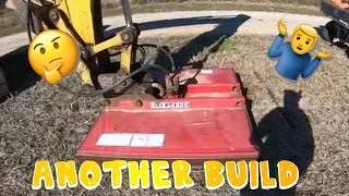 Another homemade excavator attachment in action mowing a ditch with John Deere excavator