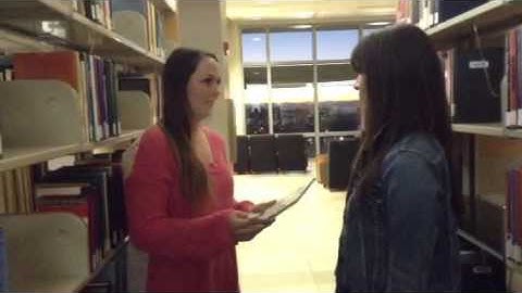 Video modeling checking out a library book