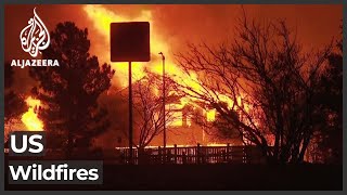 Tens of thousands flee as Colorado fires burn hundreds of homes