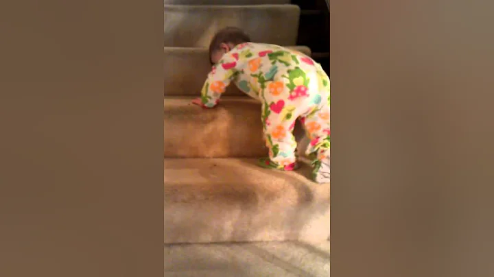 Briella climbing her first stairs