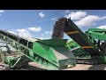 Mccloskey r155 highlighting the low profile hopper and extended overs conveyor