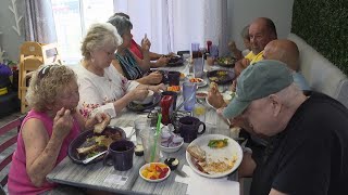 Seniors gather at restaurants for meals in a program designed to feed social lives, end loneliness
