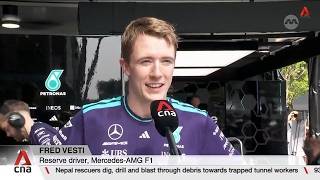Mercedes reserve driver Fred Vesti races down Orchard Road as part of motorsport festival