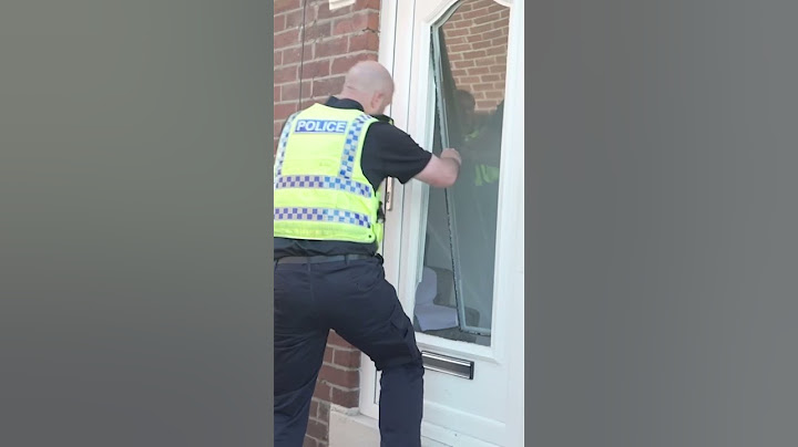 Police SMASH front door to arrest riot suspect